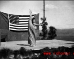 During a USO show at an American airbase Betty Yeaton performs for the service men. October 1944.