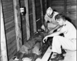 A Chinese soldier receives medical treatment from American medical personnel in the CBI during WWII.