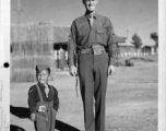 "Little Tiger Joe", well known to the 14th Air Force stationed in China, on the drill ground at 14th Air Force Headquarters with 1st Sgt. Robert Duerson of the 907th Engineers Headquarters Company, in the CBI during WWII.