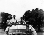 A jeep with American GIs in the CBI during WWII.  "The Stillwell Road, shortcut to Tokyo"