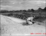 An American preparing for demolition work during the evacuation before the Japanese Ichigo advance in 1944, in Guangxi province.  Selig Seidler was a member of the 16th Combat Camera Unit in the CBI during WWII.