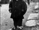 Young refugee fleeing during the evacuation before the Japanese Ichigo advance in 1944, in Guangxi province.