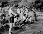 Firing Sten gun in Kweilin (Guilin, Guangxi province, China) during WWII.  Sigmeir prone, Seidler on right after shooting gun.