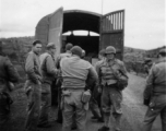 American GIs stop along the Burma Road on a cool day during WWII.