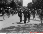 A Chinese prisoner being taken to execution site by Nationalist soldiers during WWII.