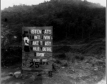 A road sign along the Ledo Road. The styling of the sign is testimony to the large number of African-American drivers and personnel on the road.  Photo from George E. Pollock.