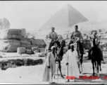 GIs ride camels in Cairo while on their way back to US from China after the end of the war.