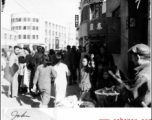 Street in Chinese city during WWII, possibly Kunming.  Photo from John Bondurant.