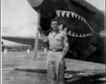 A GI with a P-40 fighter in the CBI during WWII.  Photo from J. Ellis Wood.