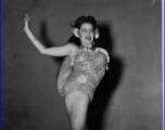 Betty Yeaton shows her contortionist skills as part of USO show at the Bengal Air Depot, during WWII.