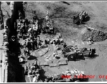 Chinese men with carts collect water at a large local well, and draw water for delivery, probably in northern China.