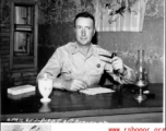 A US Army Air Force captain at a desk in China in WWII, in April 1945.