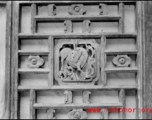 A carved wooden door panel in China. During WWII.  From the collection of Frank Bates.