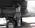 George Butsika working under wing of B-25. Yangkai, May 1944.  From the collection of Frank Bates.