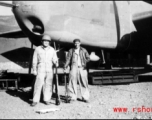 John Carberry and Claude Darni in front of B-25 and holding rifles in Yangkai, Spring 1944.