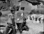 A close-up of rice threshing from the first village on the way to Yangkai. During WWII.