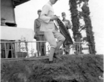 Chinese soldier of the 48th Army Division (陆军第四十八师) gets banner in a ceremony as part of a shooting contest ("射击比赛")  during a rally.