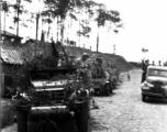 Chinese soldiers with equipment ready and covered in camouflage riding an American M3 Scout Car during exercises in southern China, in Yunnan province.