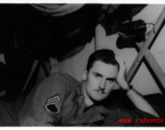 The collector posing on his bunk in the barracks. Likely in Yunnan province. During WWII.