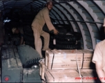 An assortment of supplies, including a four-wheeled vehicle, inside a US C-46 transport plane in the CBI during WWII.