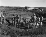 Workers dig pit outside a beef slaughterhouse at Yangkai, set up specifically to provide meat for base personnel. During WWII.