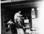 GI shops at a small shop.   Scenes in India witnessed by American GIs during WWII. For many Americans of that era, with their limited experience traveling, the everyday sights and sounds overseas were new, intriguing, and photo worthy.